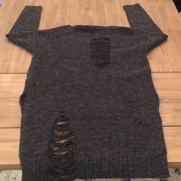 Ripped sweater. - Picture 2 of 4
